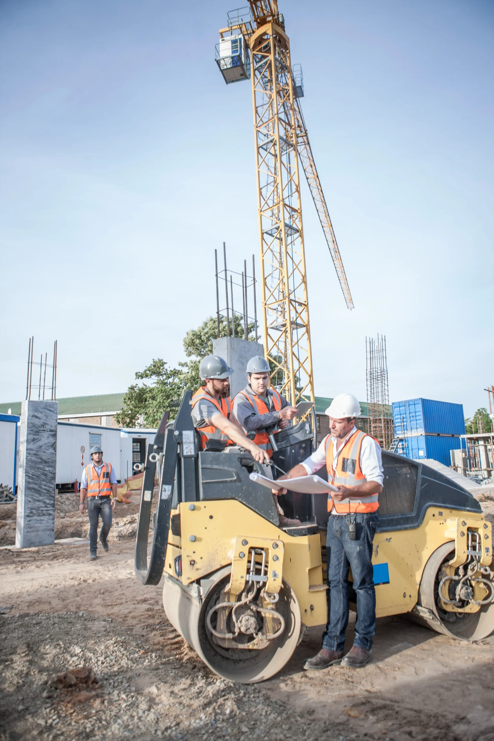 Construction site with workers and equipment demonstrating active construction management.